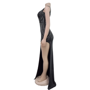 Detail view of the silver rhinestone embellishments on a black slim-fit evening gown