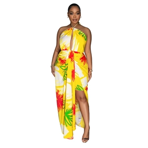 Detail of backless halter floral dress with deep V-neck and lemon yellow print