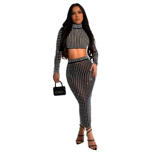 Detail of sheer black mesh two-piece set with silver rhinestone checkered patterns