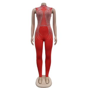 Detail of red sleeveless jumpsuit with silver rhinestones and mesh cutout for parties