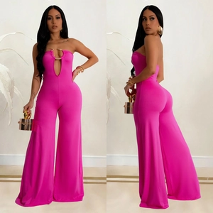 Fuchsia strapless wide-leg jumpsuit with U-shaped gold hardware and teardrop cutout