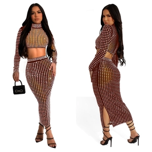 Detail showing deep brown two-piece rhinestone mesh set with high-waist skirt and crop top