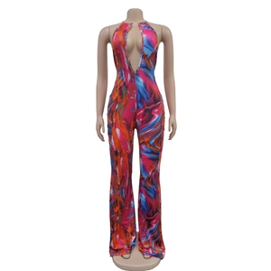 Detail of the plunging V-neckline and colorful marble print on the wide-leg jumpsuit