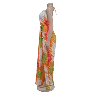 Detail view of tropical palm leaf print maxi dress with halter neck and side ruching
