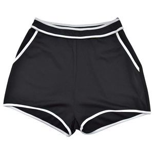 Detail of high-waist sports shorts with white piping, pockets and curved hem design