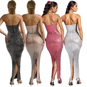 Detail view of back zipper and side slit on shimmering sequin bodycon maxi dress