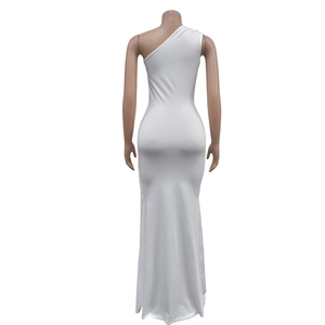 Detail of the white one-shoulder slim fit maxi dress featuring a mermaid hemline