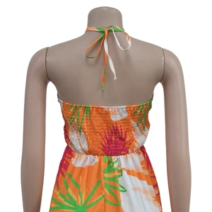 Detail of tropical palm print backless dress with elastic shirred waist and halter tie