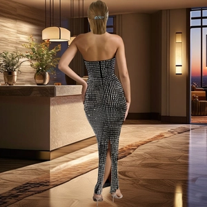 Detail shot of the sequined black and white grid dress with elegant back slit