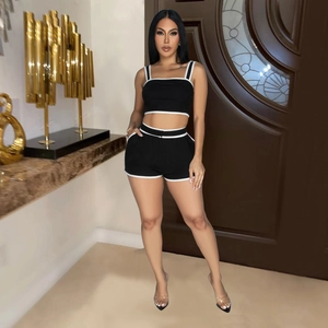 Women's black two-piece sporty set with white contrast trim slim fit crop top and shorts
