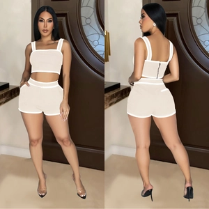 Women's chic beige two-piece lounge set with tank top and high-waist shorts