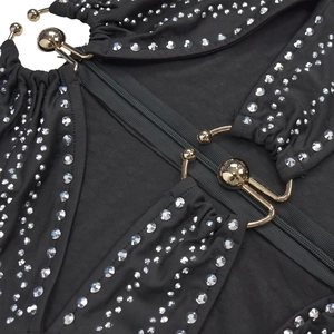 Detailed view of black rhinestone mini dress with gold metal ball buckle and zipper