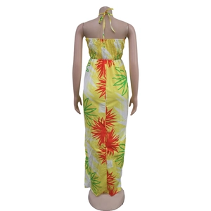 Detail of yellow backless maxi dress with tropical floral print and smocked waist