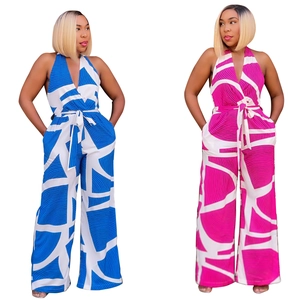 Detail of elegant V-neck halter jumpsuits featuring geometric blue and pink patterns