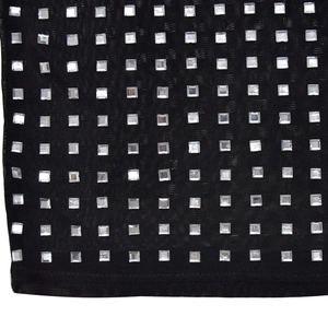 Detail of black mesh fabric with silver square rhinestones and neat edge stitching