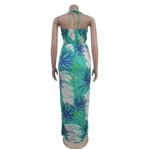 Detail of tropical leaf print halter neck dress with smocking back and tie closure