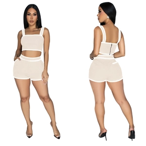 Front and back view of rib-knit crop top and high-waisted shorts set with white piping
