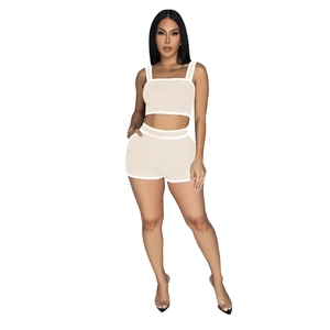 Detail of the high-waisted shorts and ribbed hem on this beige two-piece sports set