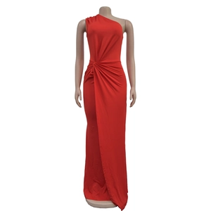 Detail of elegant red one-shoulder evening gown with waist draping and pleated details