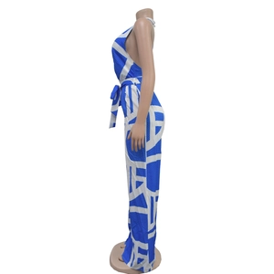 Detail of blue and white geometric print jumpsuit with halter neck and waist tie belt