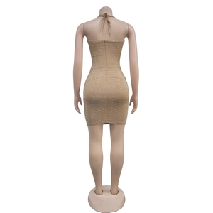 Detailed back view of rhinestone studded halter mini dress with crisscross neck tie design