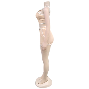 Detail of light beige two-piece lounge set featuring white contrast binding and slim fit