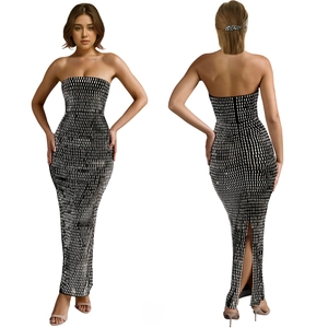 Detail of elegant black strapless maxi dress featuring shiny silver rhinestone grid patterns