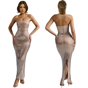 Detail of silver sequin bodycon maxi dress featuring strapless neck and back slit