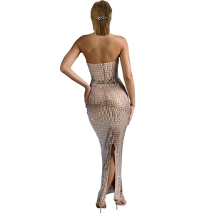 Detail of silver sequined bodycon dress featuring a high back slit and hidden zipper