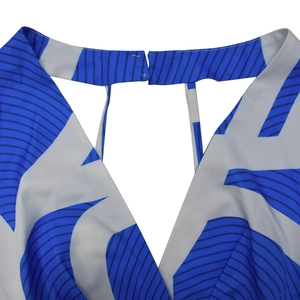 Detail shot of V-neck collar with hidden metal hook closure and blue geometric print