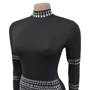 Detail of silver rhinestones on a black turtleneck long sleeve bodysuit with crystal accents