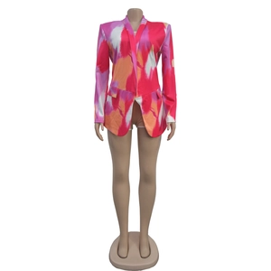 Detailed view of women's long sleeve blazer featuring vibrant abstract watercolor print