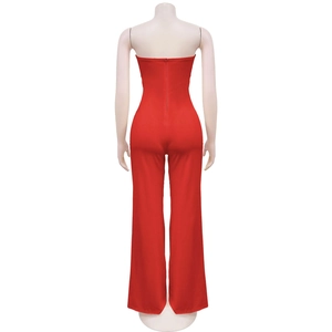 Detail of red tube top jumpsuit showing slim fit back and concealed zipper closure