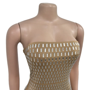 Detail of khaki strapless top featuring vertical rows of shimmering silver rhinestones