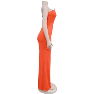 Detail of slim-fit bright orange strapless jumpsuit with side zipper on mannequin