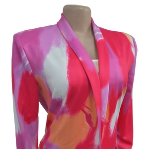 Detail of colorful abstract print and tailored notched lapels on women long sleeve blazer