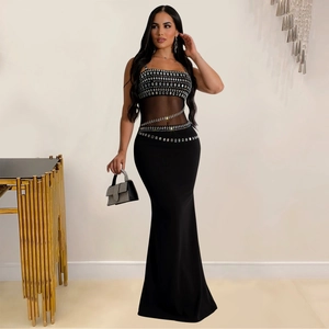 Detail of black fisheye evening dress with sparkling rhinestones and mesh patchwork