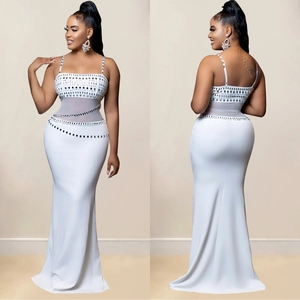 Elegant white mermaid evening gown with rhinestone bodice and sheer mesh waist paneling