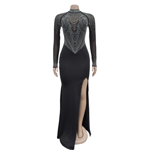 Close-up of black mesh dress featuring intricate silver rhinestone geometric patterns