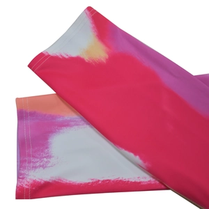 Detailed view of colorful tie-dye patterns and high-quality stitching on elastic fabric