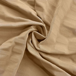 Detail view showing the elegant spiral drape and soft texture of the khaki fabric dress