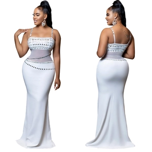 Detailed view of white mermaid evening gown featuring silver sequins and mesh panels