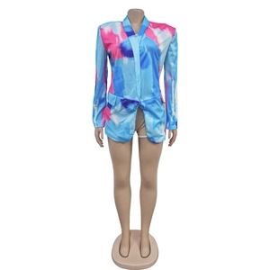 Detailed close-up of colorful watercolor tie-dye print on women's long sleeve blazer
