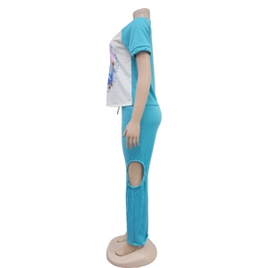 Detail of blue loungewear set featuring a shoulder print and knee cut-out design