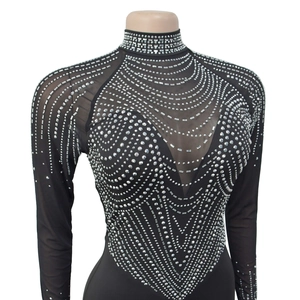 Detail view of heart-shaped silver rhinestones on sheer mesh of a black bodysuit