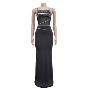 Detail of elegant black evening gown showing rhinestone bodice and mesh waist inserts