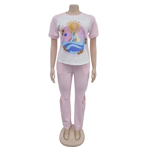 Detail view of pink cotton set featuring sun printed t-shirt and drawstring cuffs pants