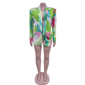 Detail of colorful abstract watercolor print on women's long sleeve blazer jacket