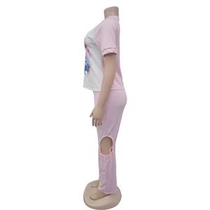 Detail of pink lounge set showing knee cut-outs with tie-up ribbons and floral print