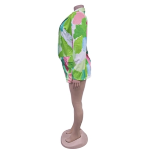 Side view of women's two-piece suit set featuring vibrant abstract oil painting print